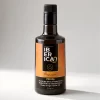 Botella de aceite de oliva virgen extra premium Iberica9 Picual de 500 ml sobre fondo gris.