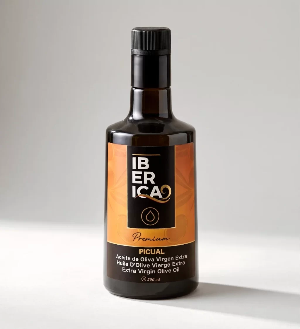 Botella de aceite de oliva virgen extra premium Iberica9 Picual de 500 ml sobre fondo gris.